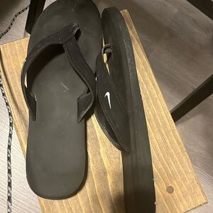 Nike women flip flops. Barely worn. Women size 12.